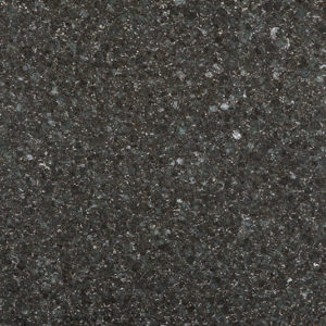 A close up of the surface of a black granite slab.