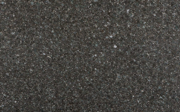 A close up of the surface of a black granite slab.