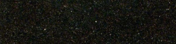 A black granite surface with some white spots.