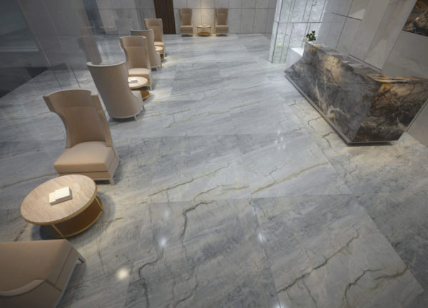 A marble floor with chairs and tables in the center.