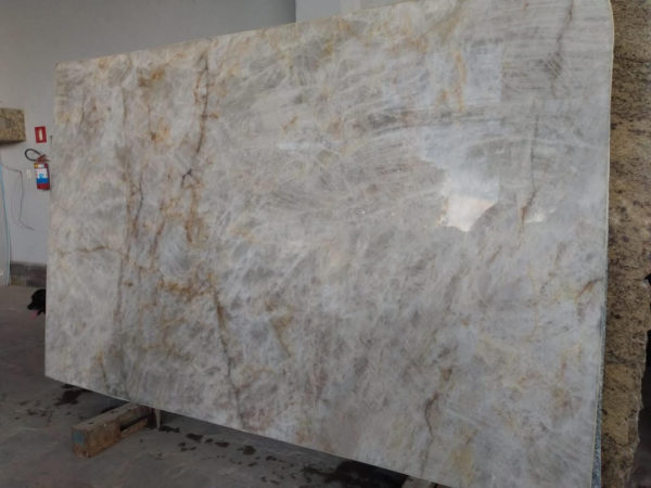 A marble slab with some brown and white spots