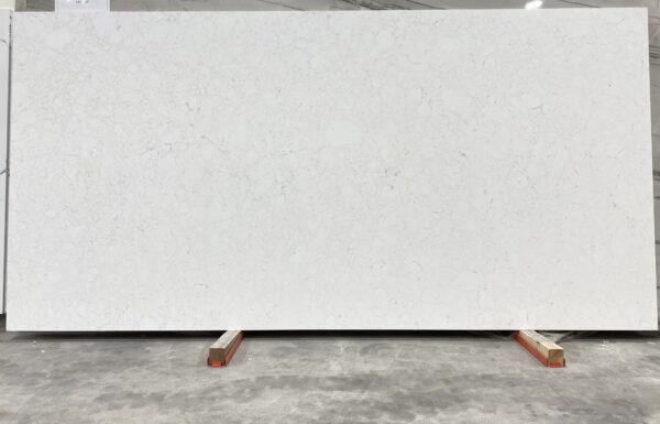 A white slab of marble on top of a concrete floor.