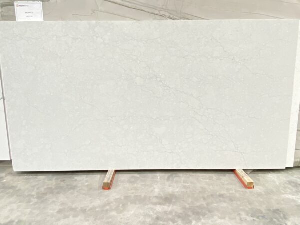 A white slab of marble on top of a concrete floor.
