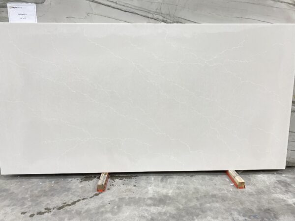 A white slab of marble on top of concrete.
