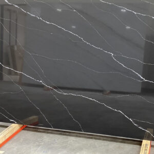 A black marble slab with white veins on it.