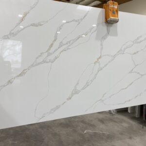 A slab of white marble with a large amount of material on it.