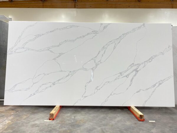 A slab of white marble with a large amount of paint on it.