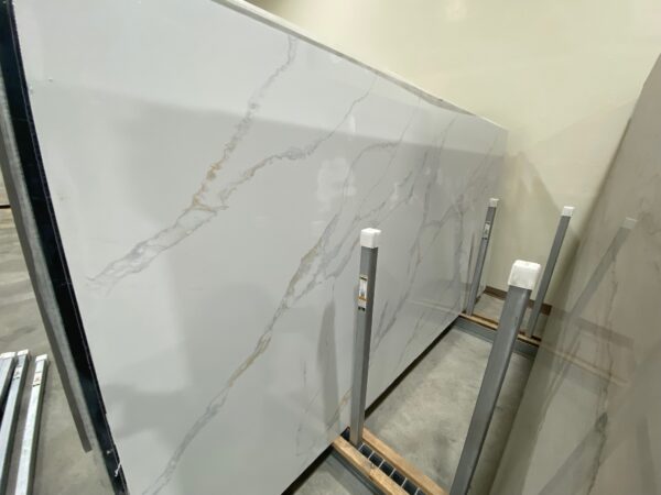A marble slab being installed in the middle of a room.