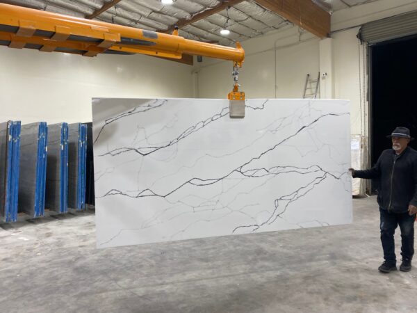 A large slab of white marble in an industrial setting.