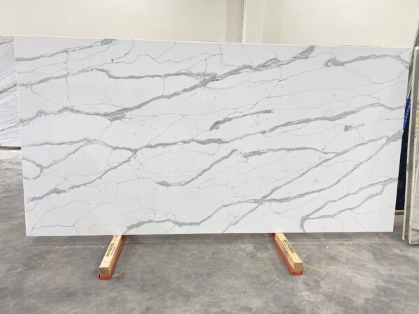 A slab of white marble with some wood on top