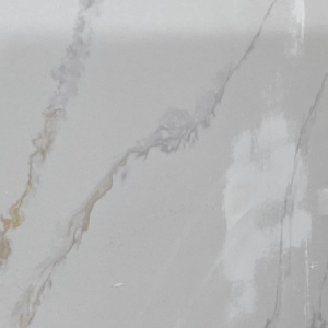 A white marble surface with some brown spots