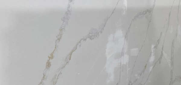 A white marble surface with some brown spots
