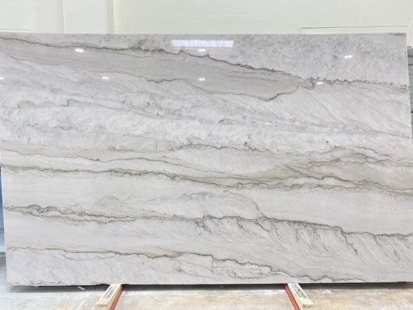 A slab of marble with some white and grey colors