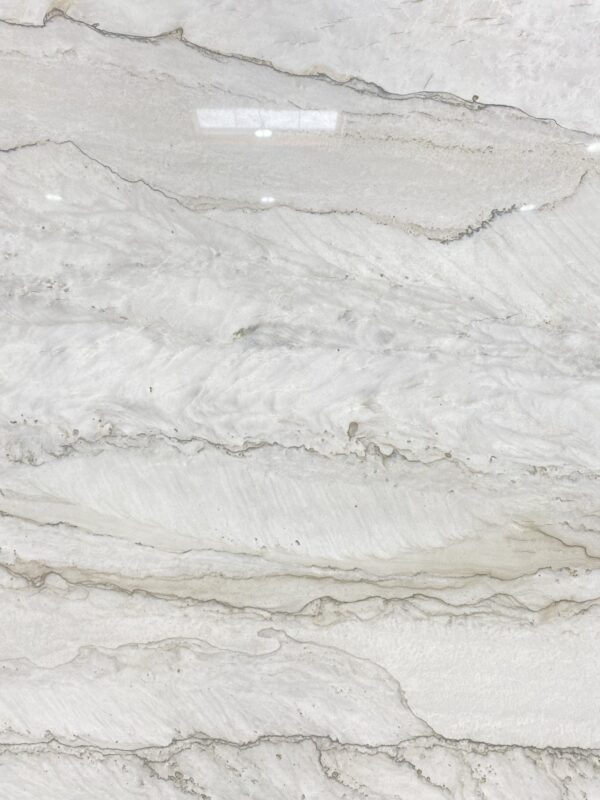 A white marble surface with some very pretty lines.