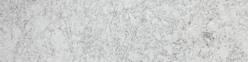 A white marble surface with some gray and black spots